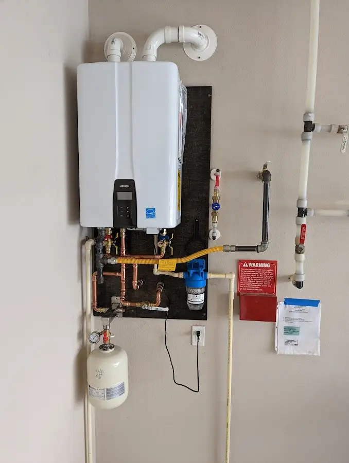 Professional plumber installing copper piping in a Union home